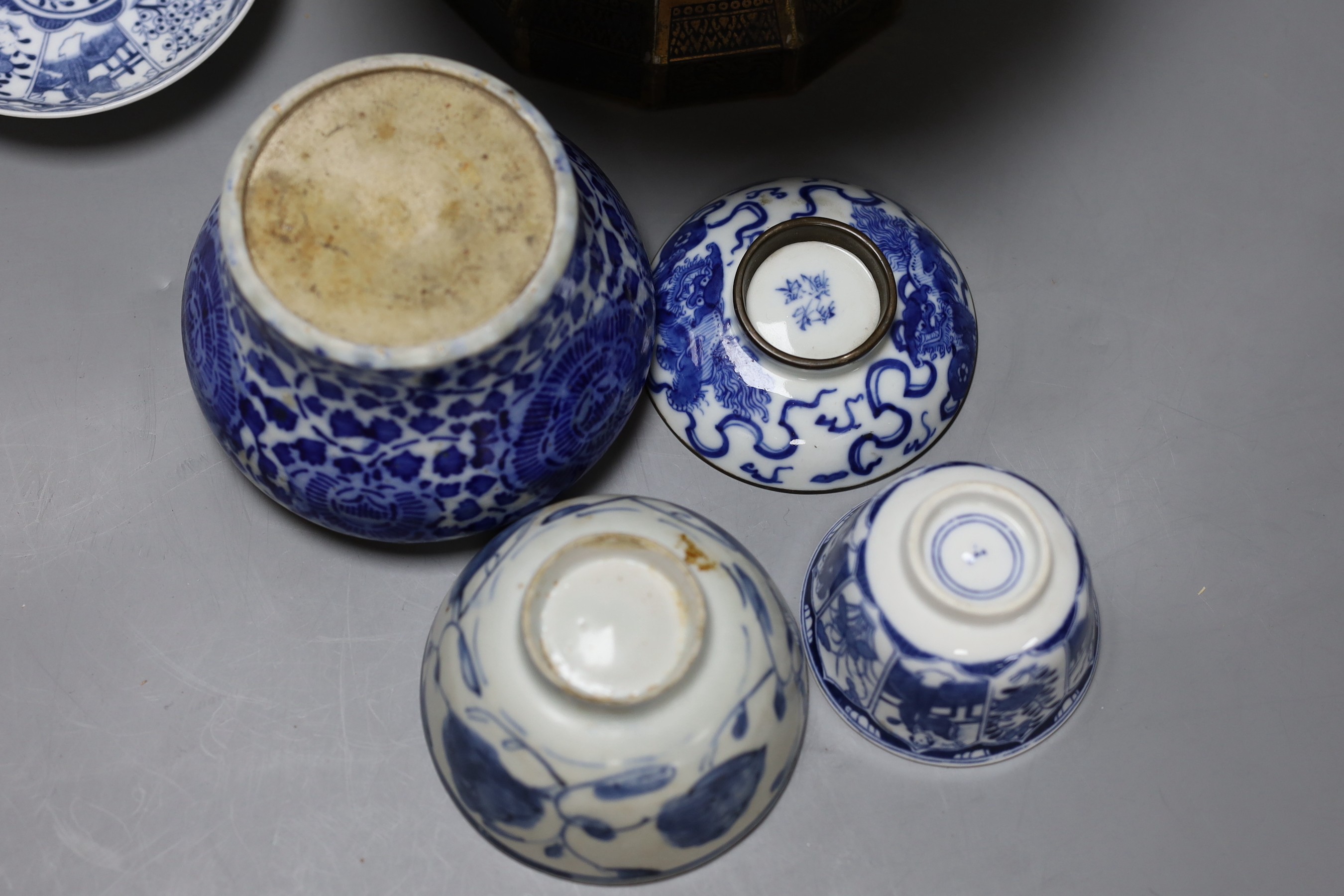 A collection of Chinese blue and white tea bowls, a vase, metal planter and book on Hong Kong by John and Veronica Stericker, (7)
